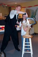 Magician Scott Henderson performing the SCARY Arm Chopper magic trick at a birthday party in Overland Park, KS